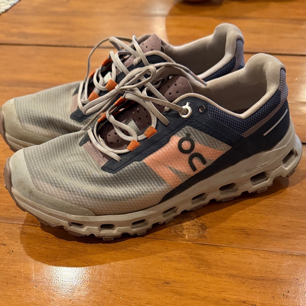 On Running Shoes with Cream and Black Accents